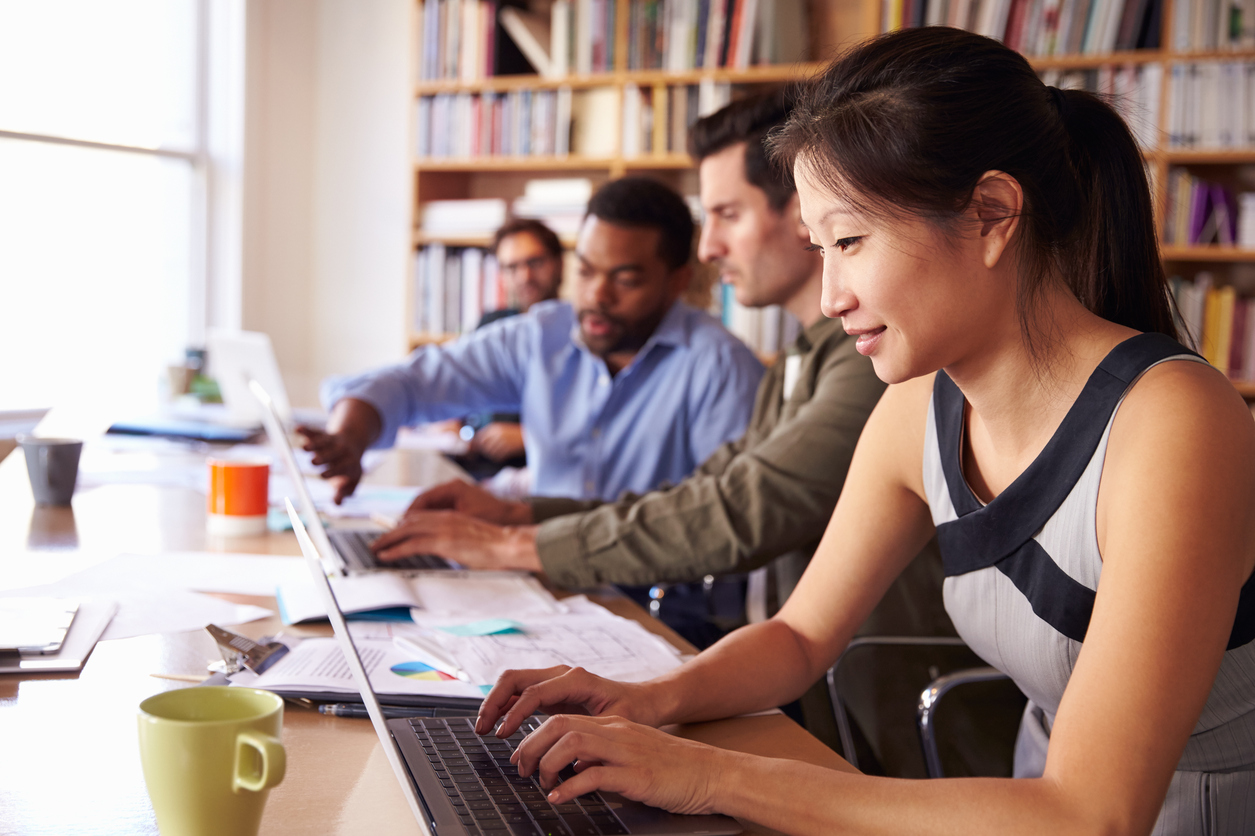 Woman working at a laptop in an office